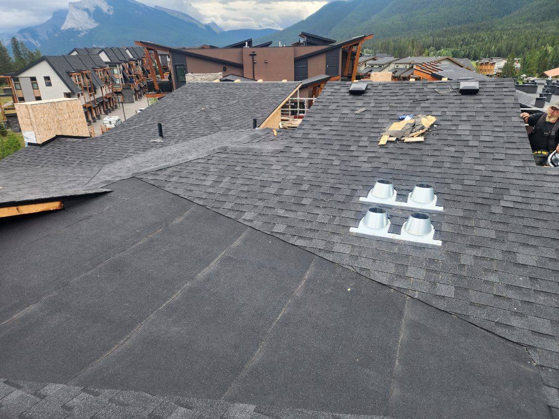 Townhouse roofing project in the mountains, skylights in place
