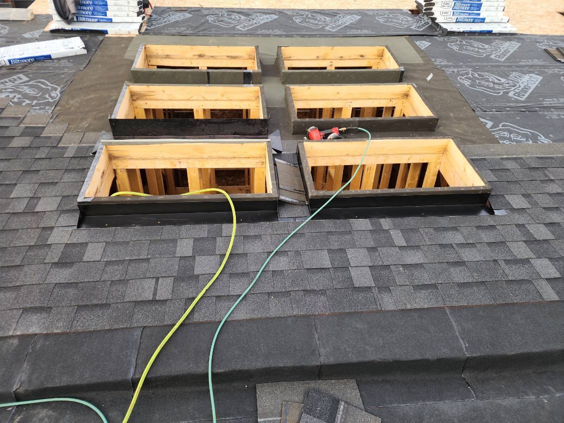Skylight openings framed and ready during a re-roof