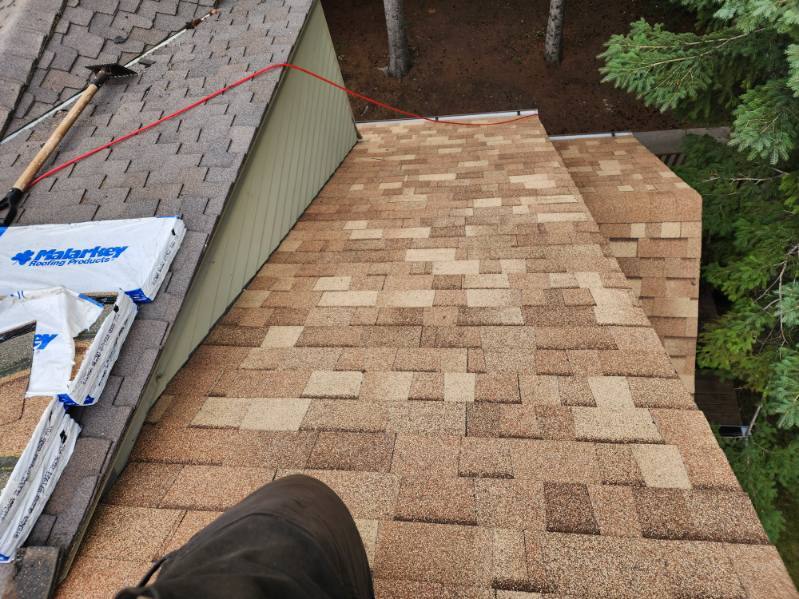 Hand-laying architectural shingles, course by course